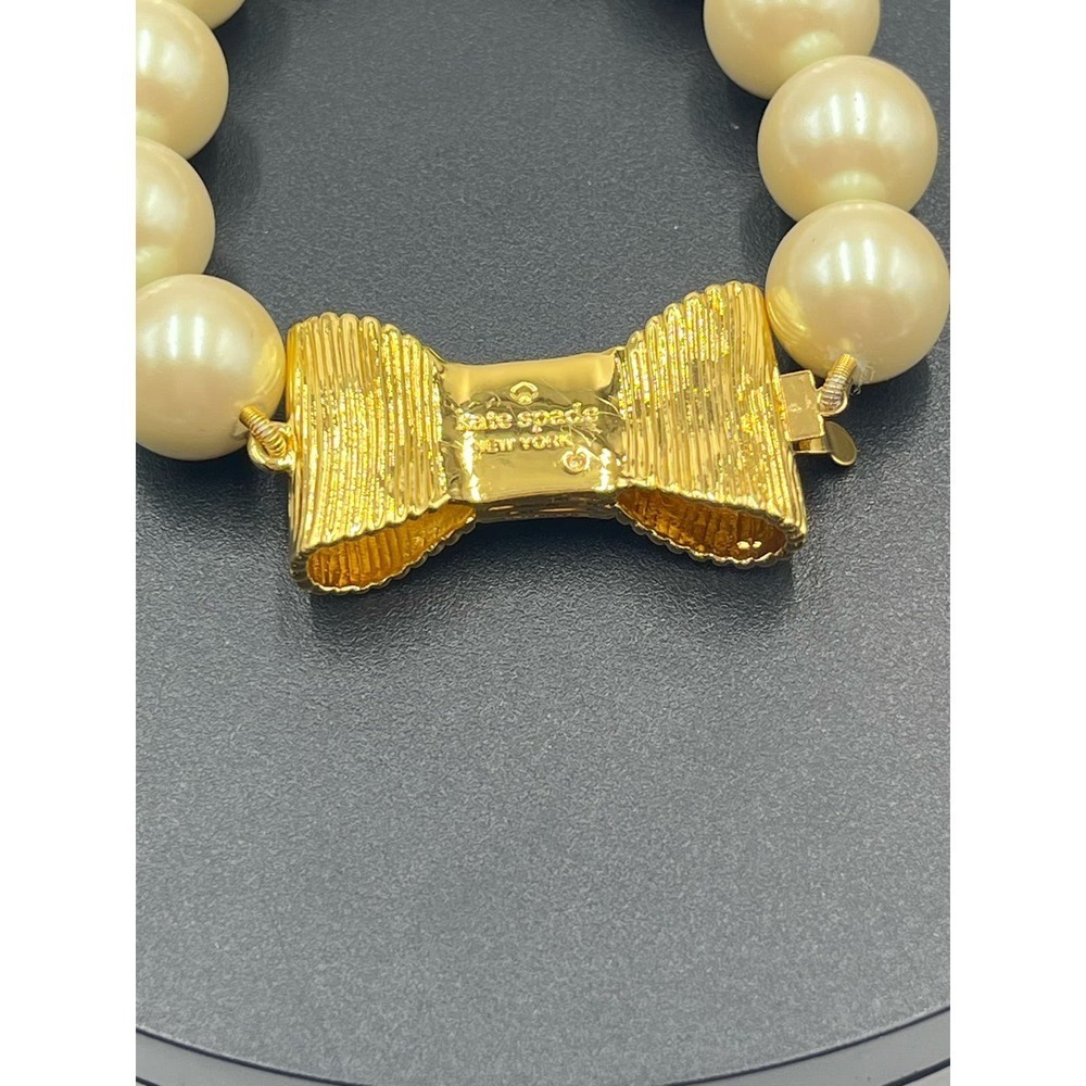 Kate Spade All Wrapped Up Pearl Gold Bow Bracelet - Picture 3 of 13